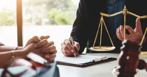 Lawyer explaining case with scales.